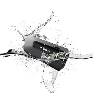 A cardo packtalk pro bluetooth motorcycle helmet headset splashes into water, demonstrating its IP67 waterproof capability.