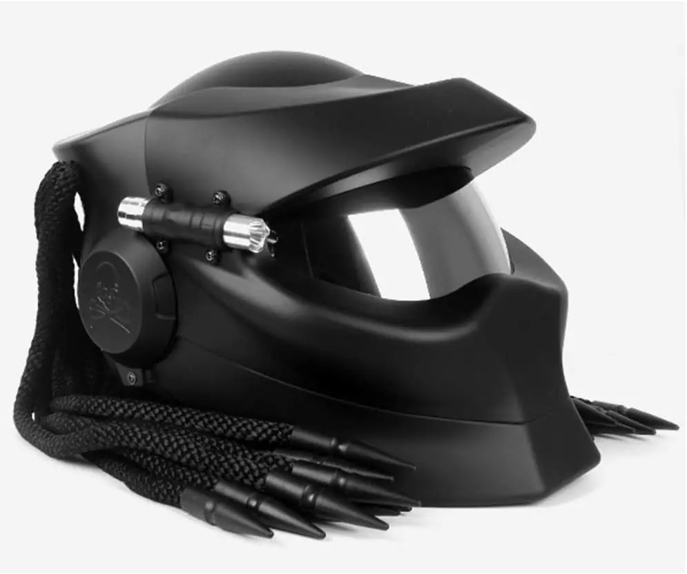 Predator-Motorcycle-Helmet A matte black, Predator-themed motorcycle helmet with bluetooth, featuring distinctive braided dreadlocks and a dark visor.